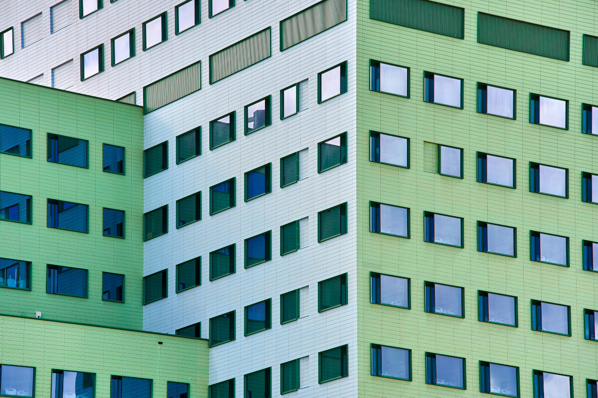 Tonality reference: Cadix Clinic Terracotta Tile Antwerpen facade - modern architecture with elegant terracotta cladding