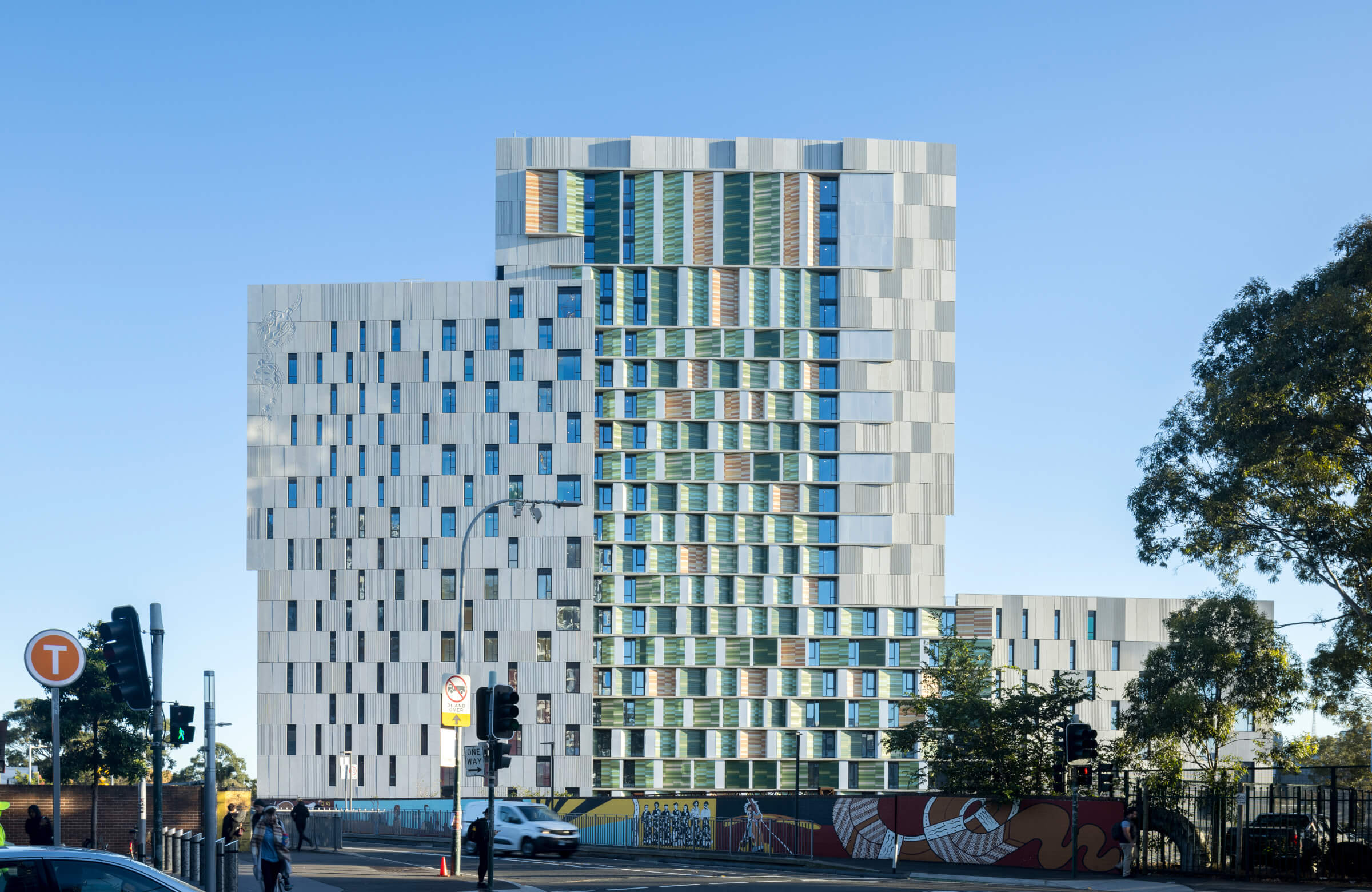 Terracotta facade of student housing - wide view showcasing sustainable and modern design