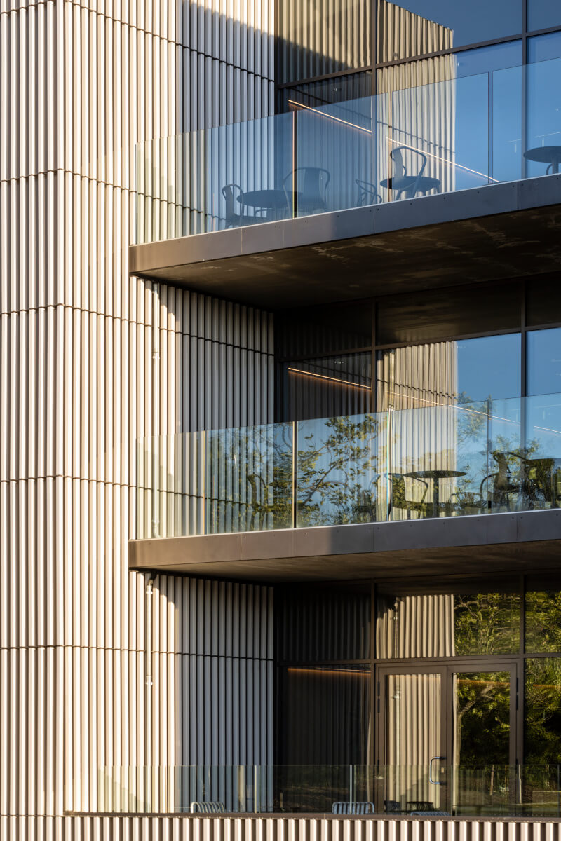 Balcony view of Velliv Ballerup office in Denmark featuring square terracotta facade for an elegant look