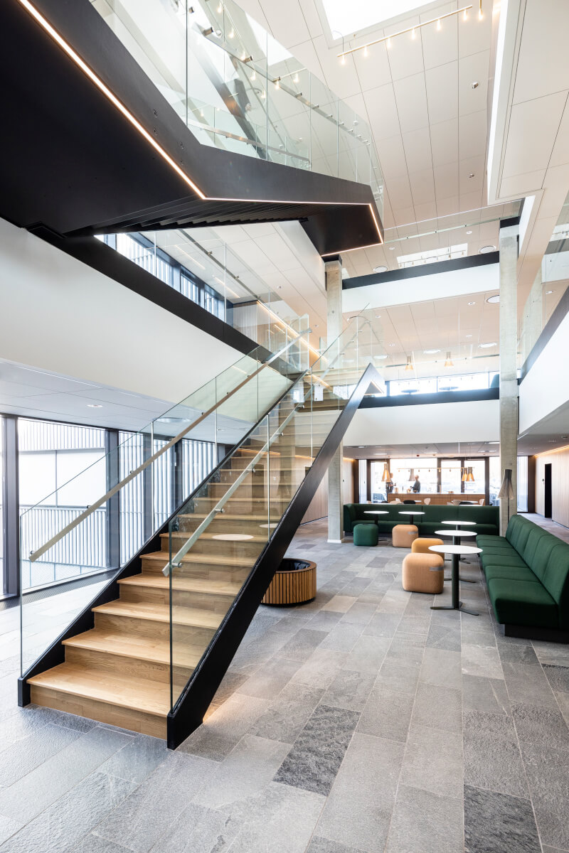 Office stairs in Velliv Ballerup Office, Denmark featuring tonality reference terracotta facade
