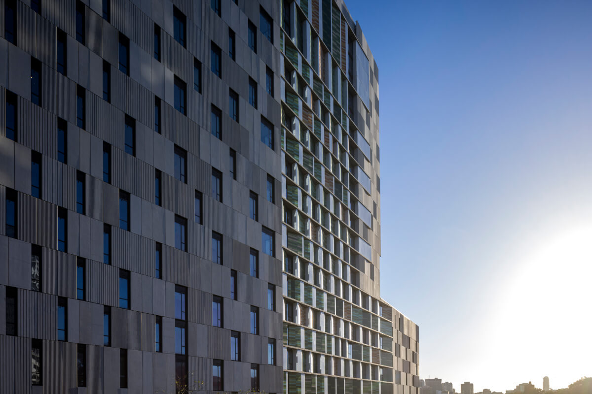 Tonality terracotta facade at Coljames student housing - stunning afternoon and sundown view of a sustainable and modern building design using high-quality ceramic materials