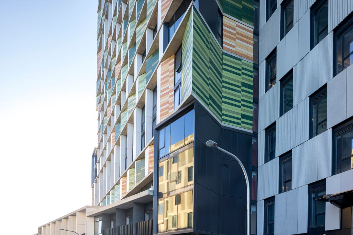 Tonality terracotta facade at Coljames student housing - colorful and sustainable building design using high-quality ceramic materials